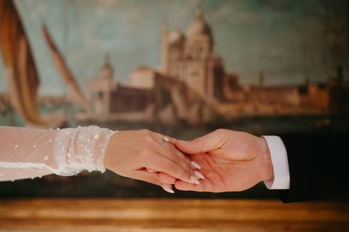 Bride and groom holding hands
