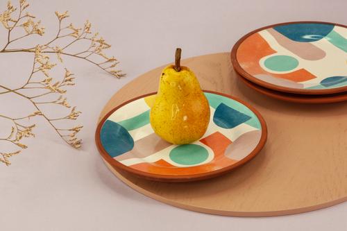 Pear in colorful plate