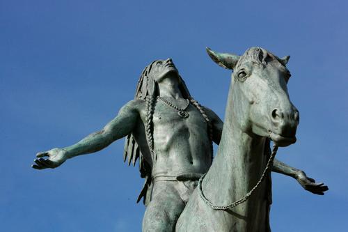 Statue of Native American man on horseback
