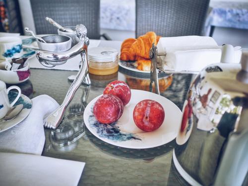Plums at hotel breakfast