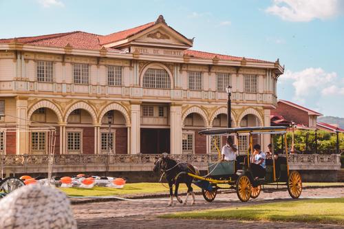 Hotel and horse carriage, Philippines