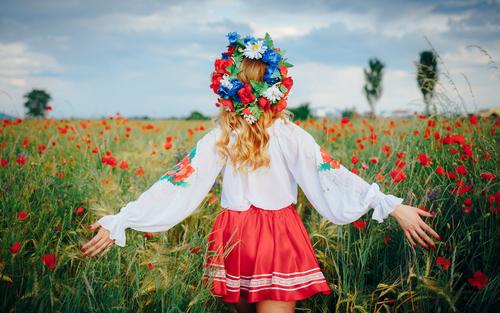 Girl in field of poppies, Ukraine