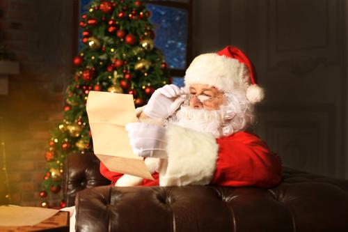 Santa Claus reading a letter