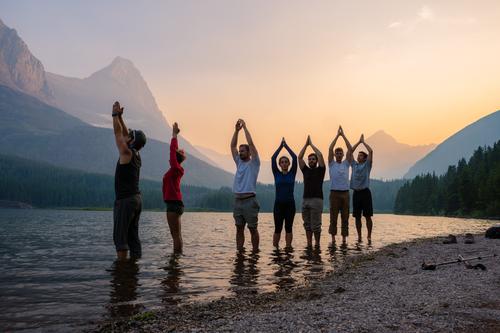 Group yoga by the lake