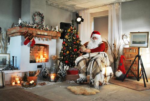 Santa Claus by the fireplace