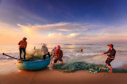 Pescadores en la playa