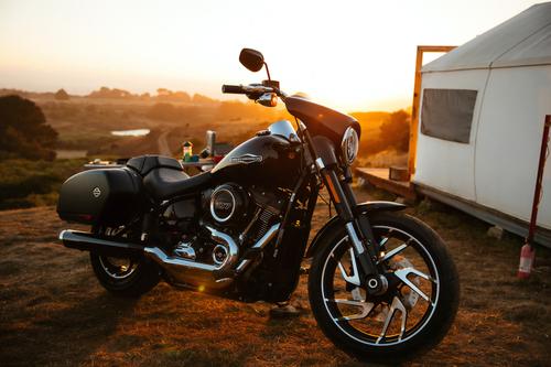 Black motorcycle at sunset