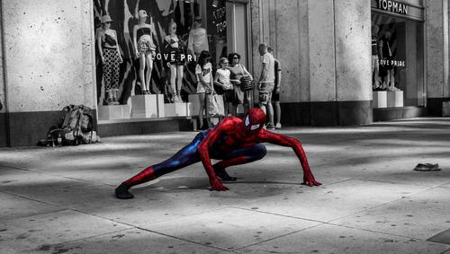 Colored spider man in a black and white setting