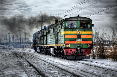 Colorful train in a dim landscape