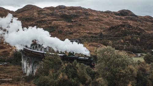 Train crossing the Glenfinnan Viaduct, Scotland
