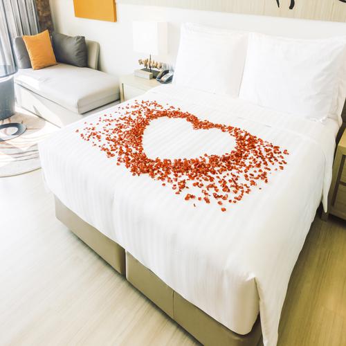 White bed with petals