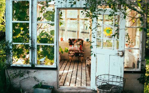 Greenhouse with colorful chair