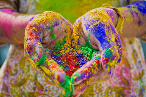 Hands with colorful powder