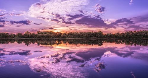 Purple sunset reflected on a lake