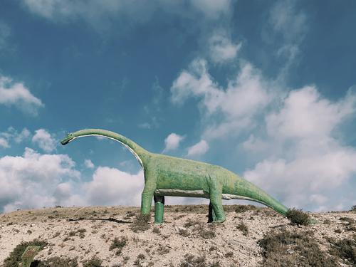Statue of a green dinosaur